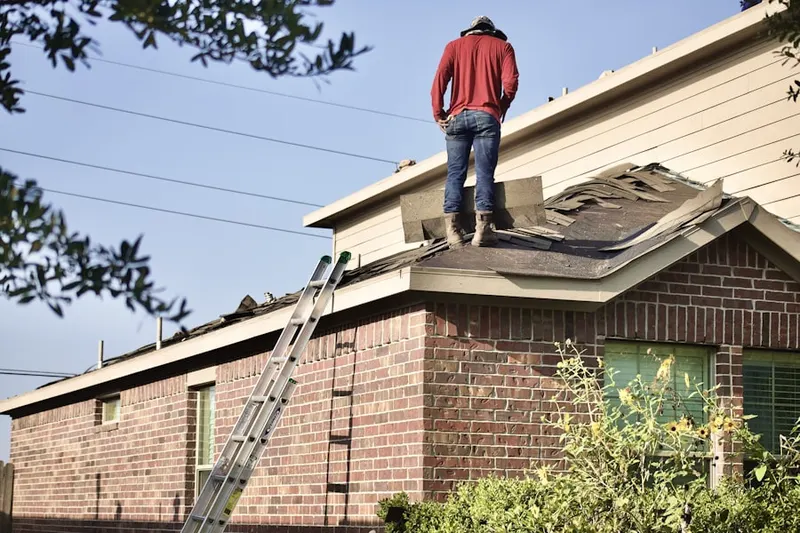 Professional roofer working on a residential roof in Stonewood Acres